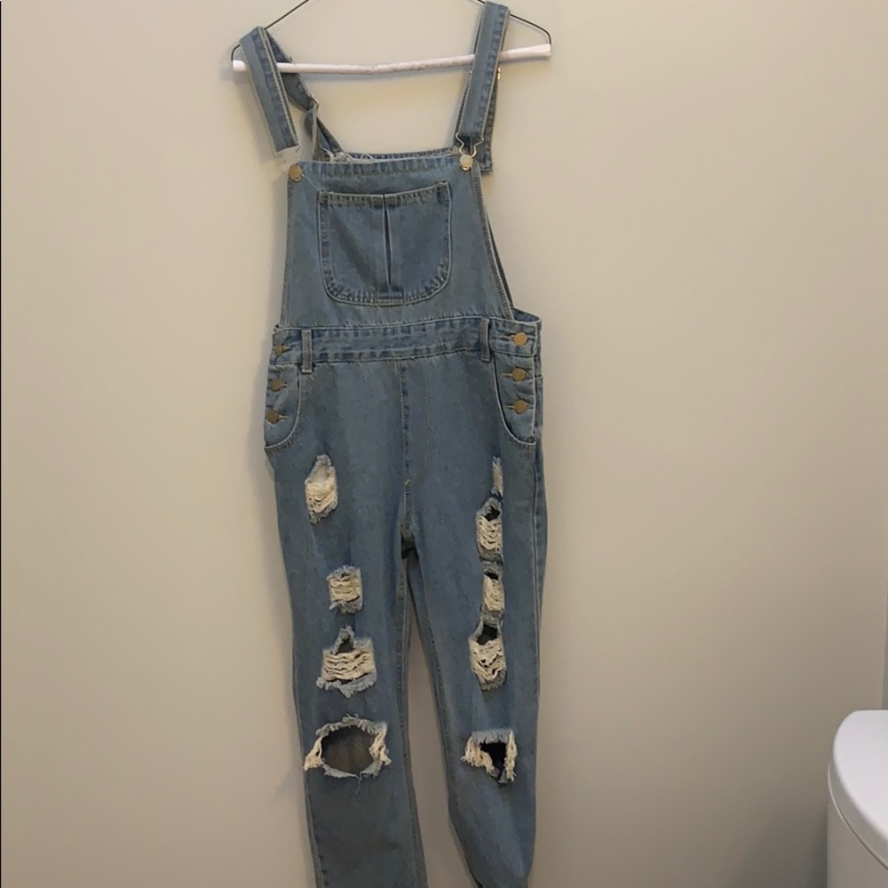 Ripped jean overalls